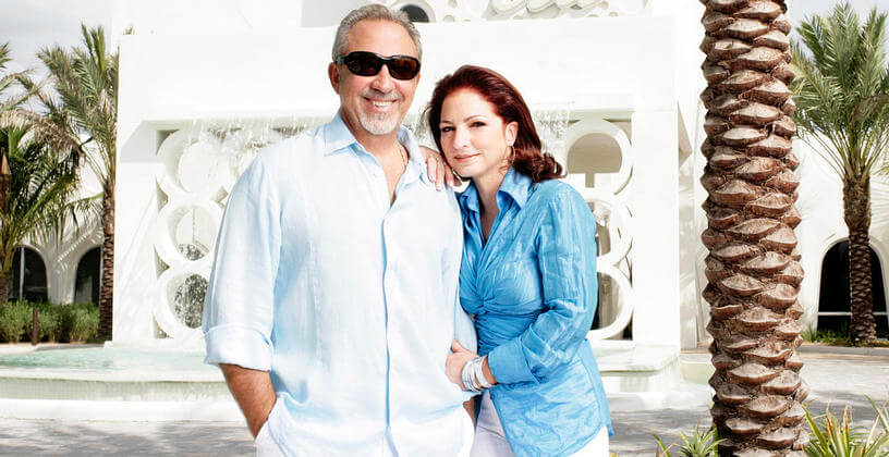 gloria estefan and emilio estefan standing in front of costa d'este