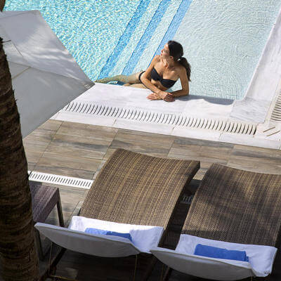 woman laying in the pool at costa d'este