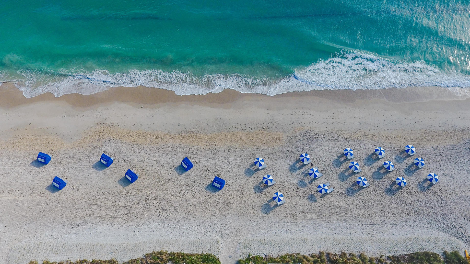 beach umbrellas and tents in the beach at costa d'este