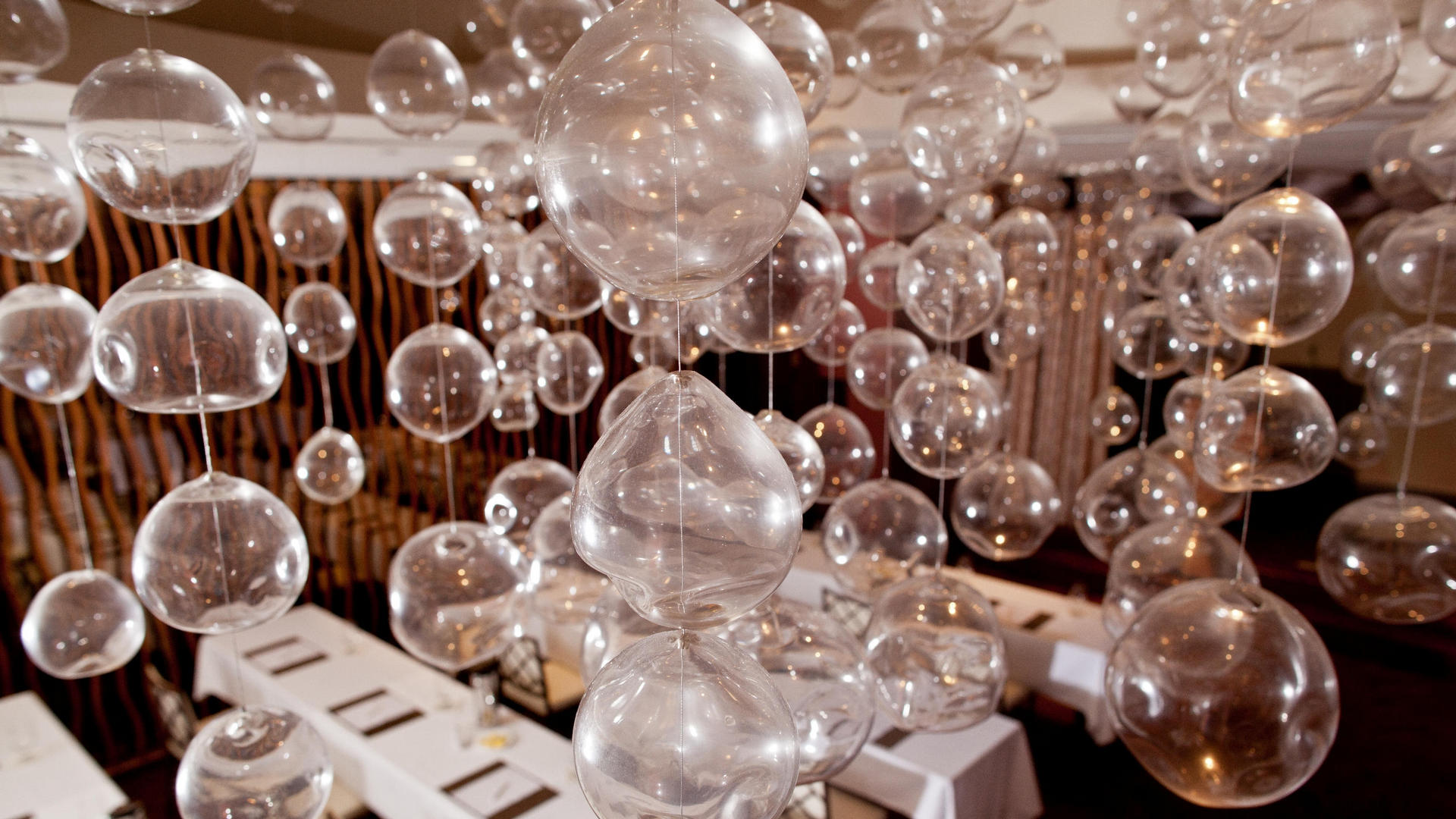 floating bubble lights in a room at costa d'este