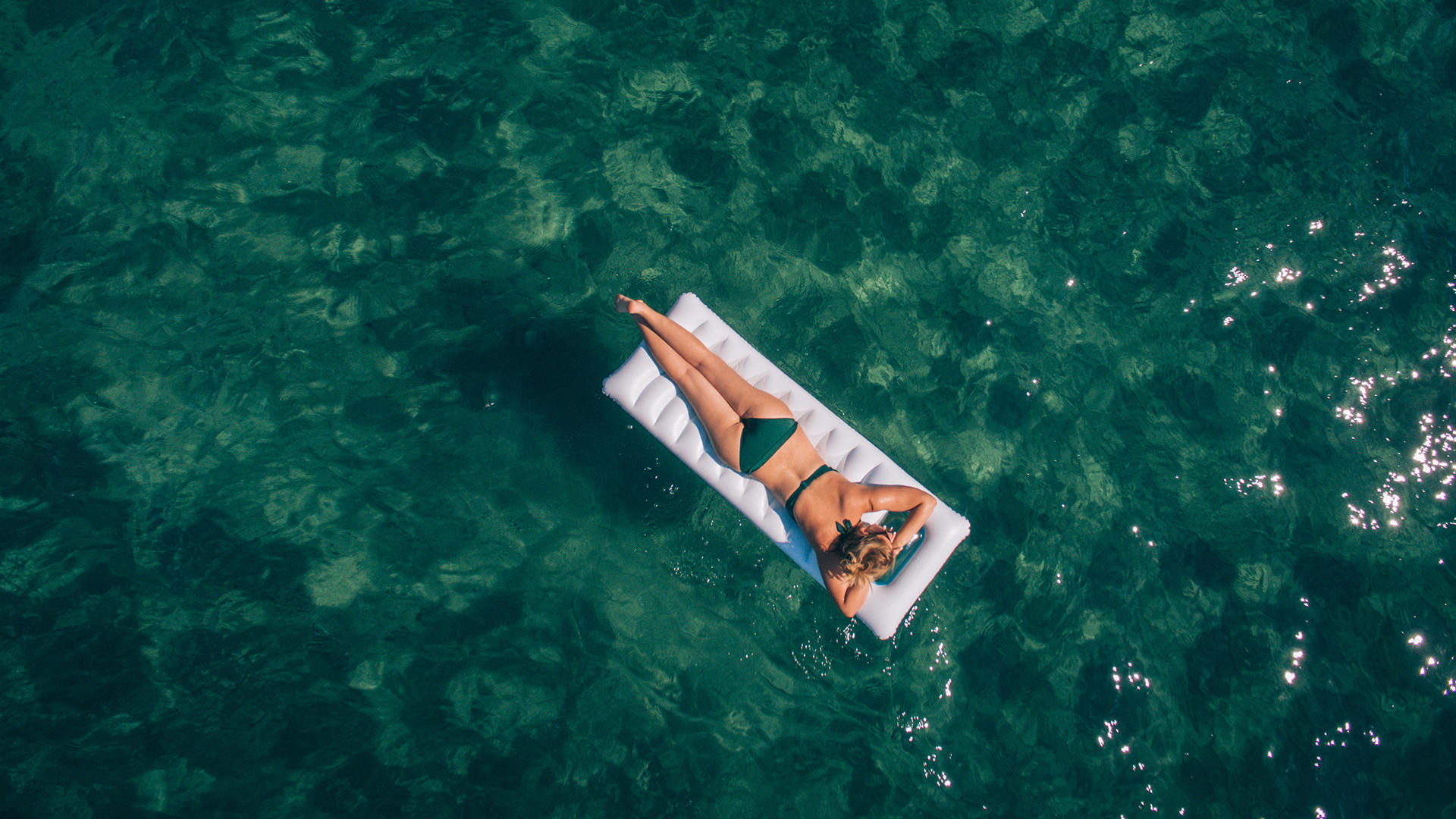 Girl Floating in Ocean