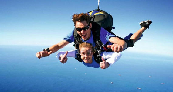 a man and woman skydiving