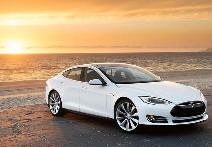 tesla car on the beach at costa d'este