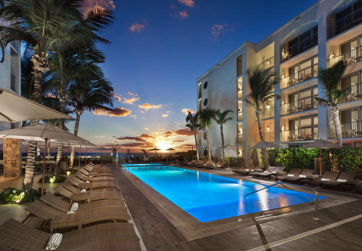 evening time at the pool outside costa d'este