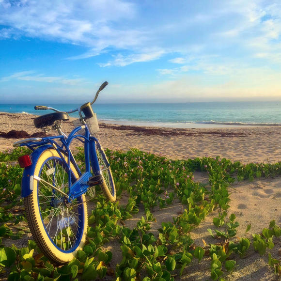 bike planted on the beach outside costa d'este