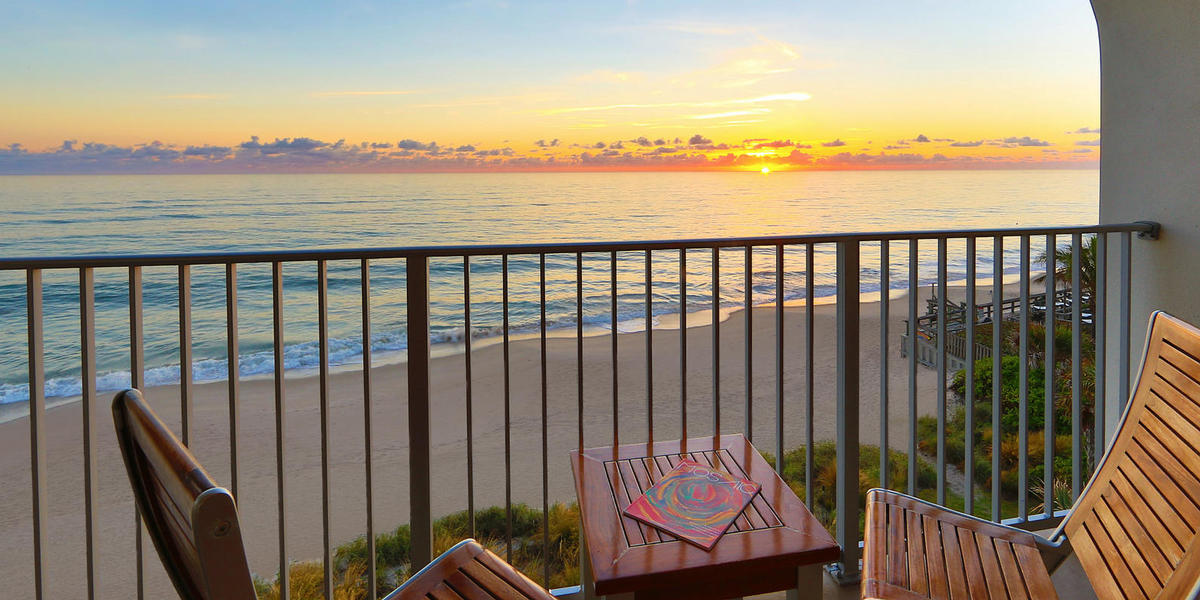 Table on a balcony overlooking the ocean at Costa d' Este