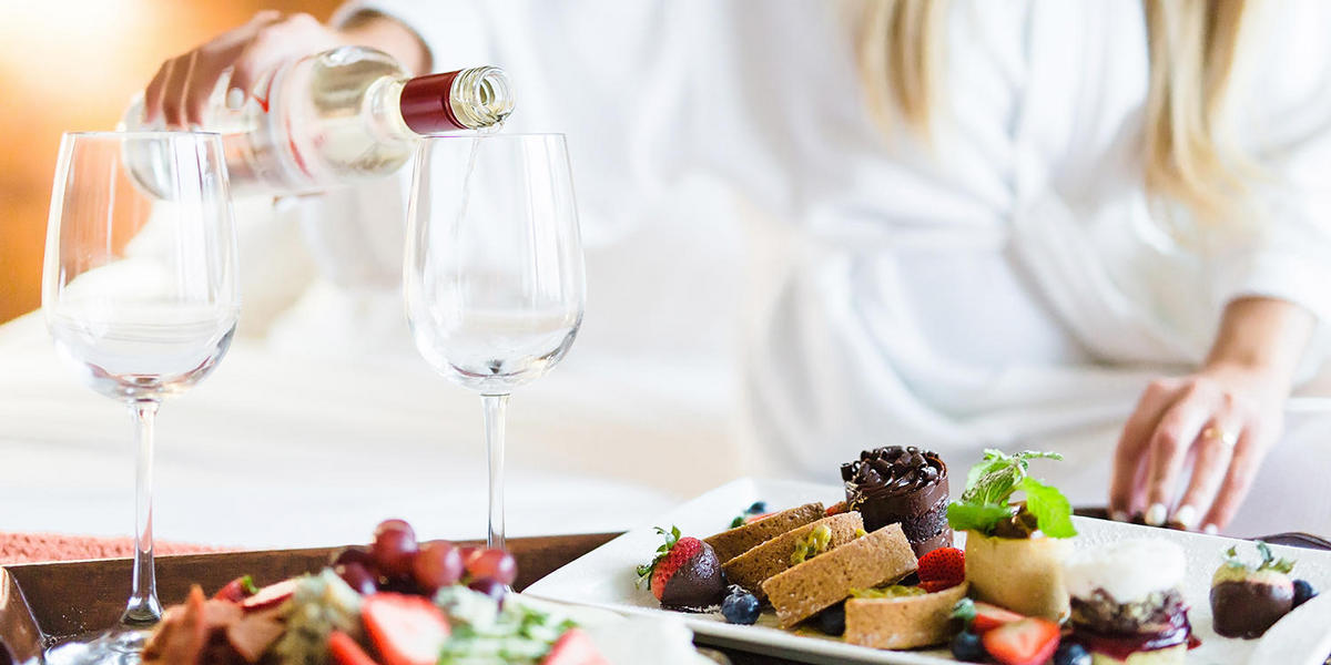 Woman enjoying food in her guest accommodations