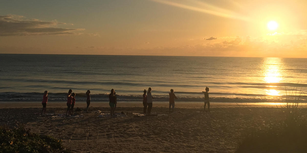 Sunrise yoga on the beach