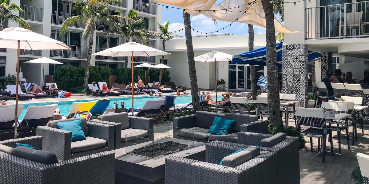 Sitting area by the pool at Costa d' Este